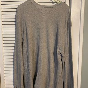 Two men’s grey thermal shirts